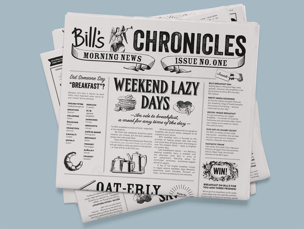 image showing stack of Bill’s branded newspapers on a light blue background on white paper with black text reading ‘Bill’s Chronicles, Morning News, Issue no. One’ and various articles included one titled ‘Did someone say breakfast?’ with translations of the word into various languages, and ‘Weekend Lazy Days’ with the sub-heading ‘an ode to breakfast, a meal for any time of the day’ with illustrations of pancakes, tarts and a tea set