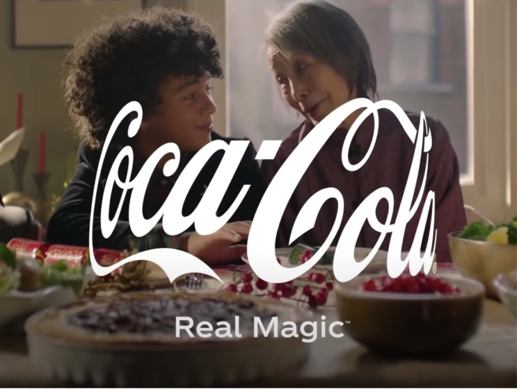 Coca Cola brand design example with logo and tag line.