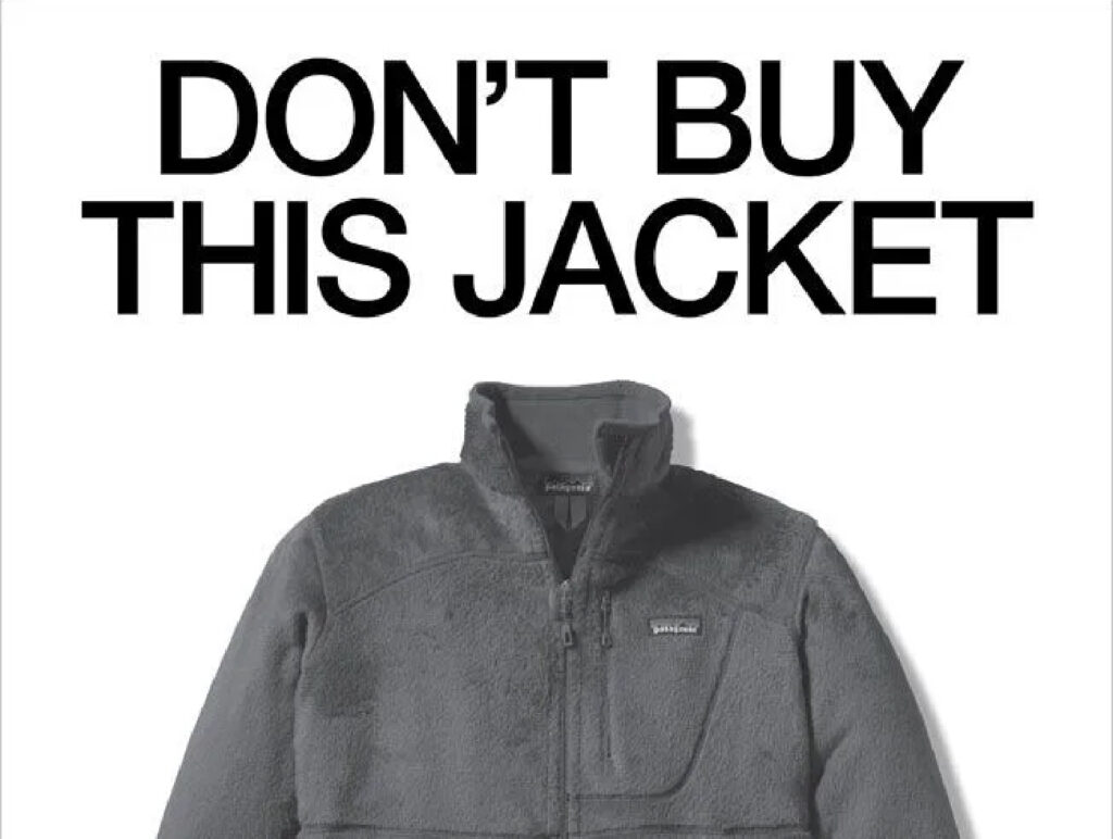A big text saying DON'T BUY THIS JACKET on top of a grey jacket
